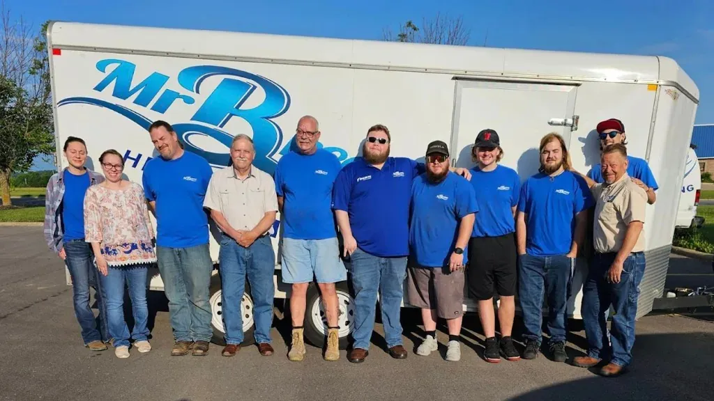 The Mr. Breeze Heating & Cooling crew lined up in front of a Mr. Breeze trailer