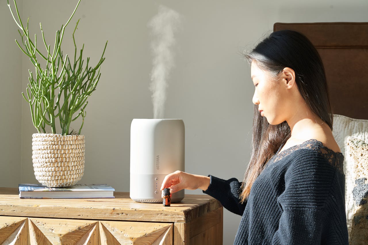 woman using humidifier